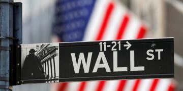 Dow, S&P close at record highs as Omicron worries ease