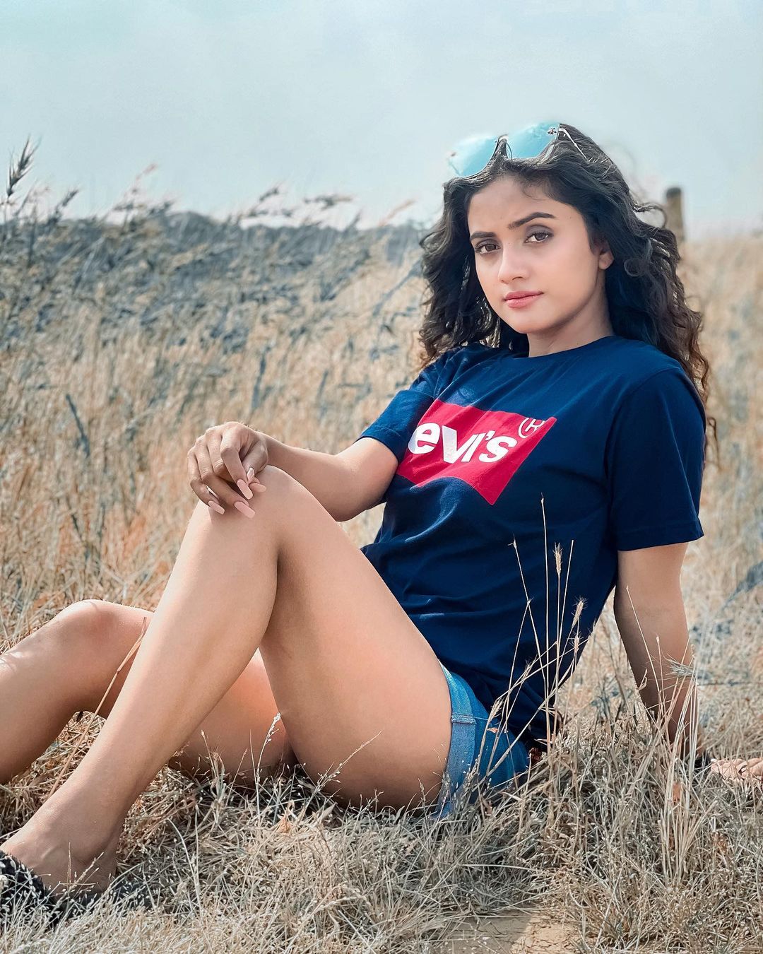 Nisha Guragain sitting in grass
