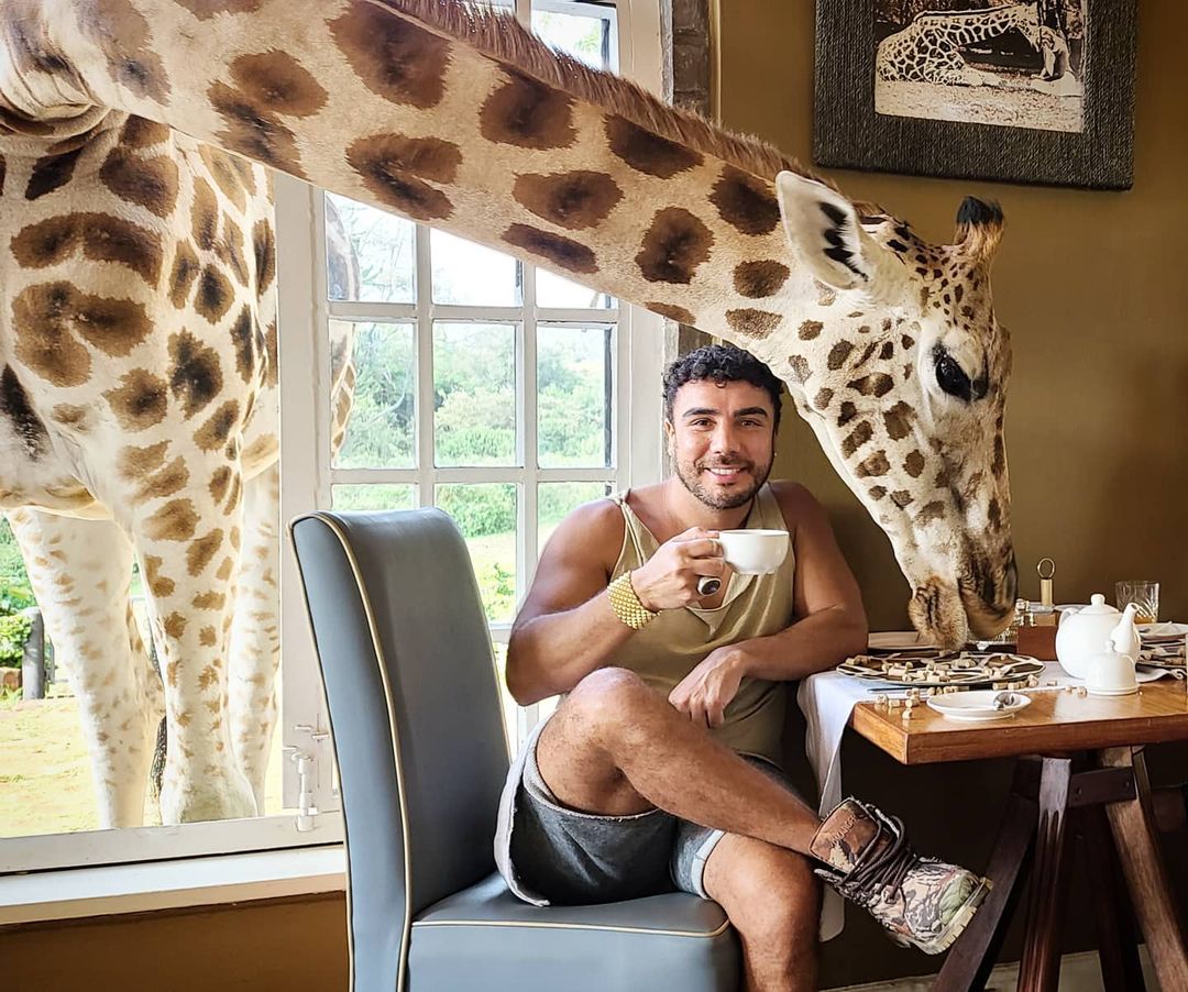 Tony Garza with giraffe