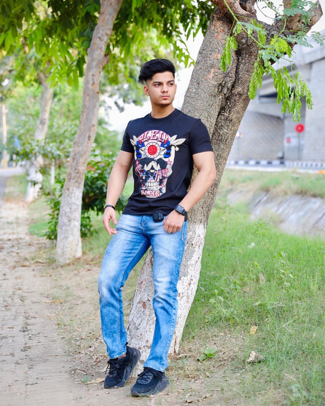 sehaj zaildar leaning against a tree