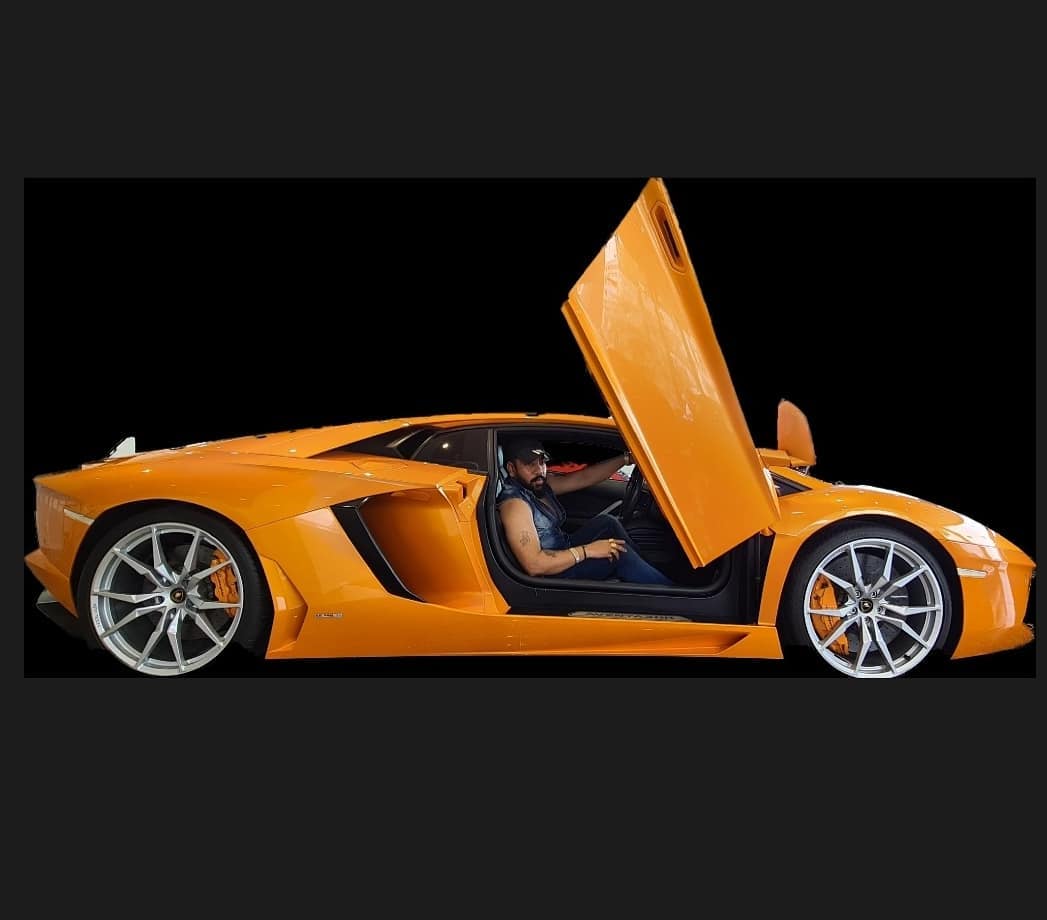 Raja Gujjar in orange car