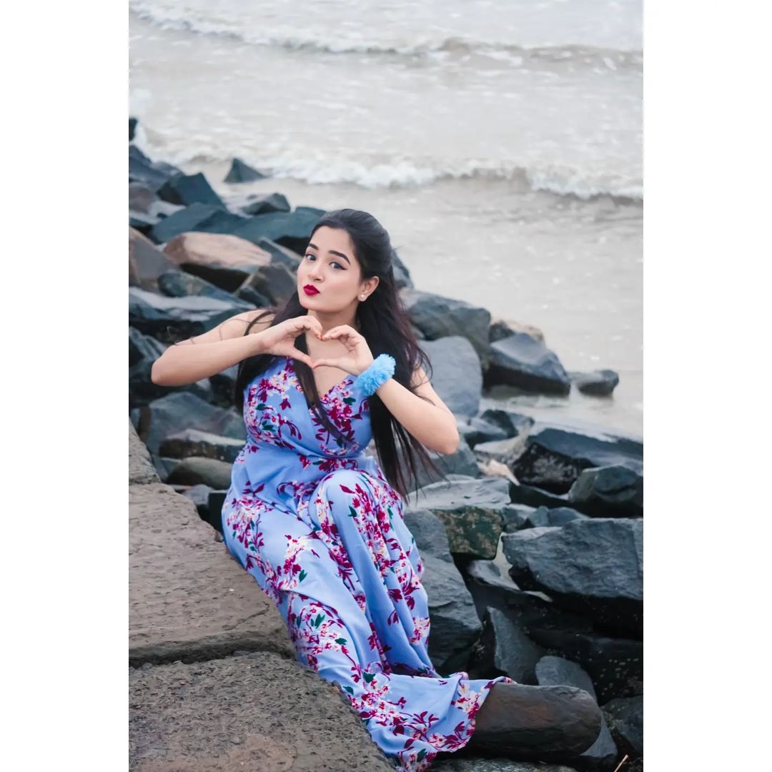 nilanjana dhar sitting on rocks
