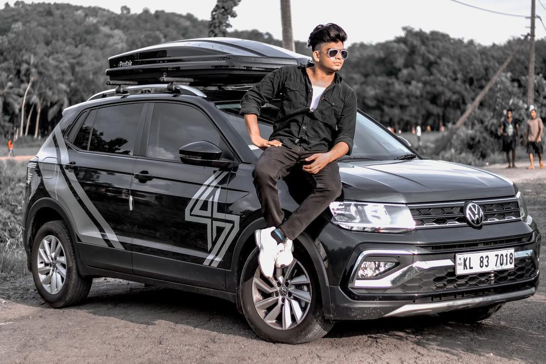 Steeve Joseph sitting on car bonnet